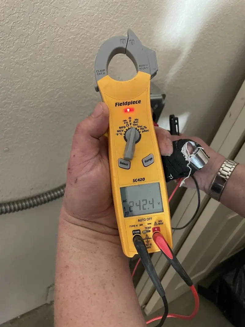 Voltage testing with clamp meter during Circuit Breaker Repair in Newport